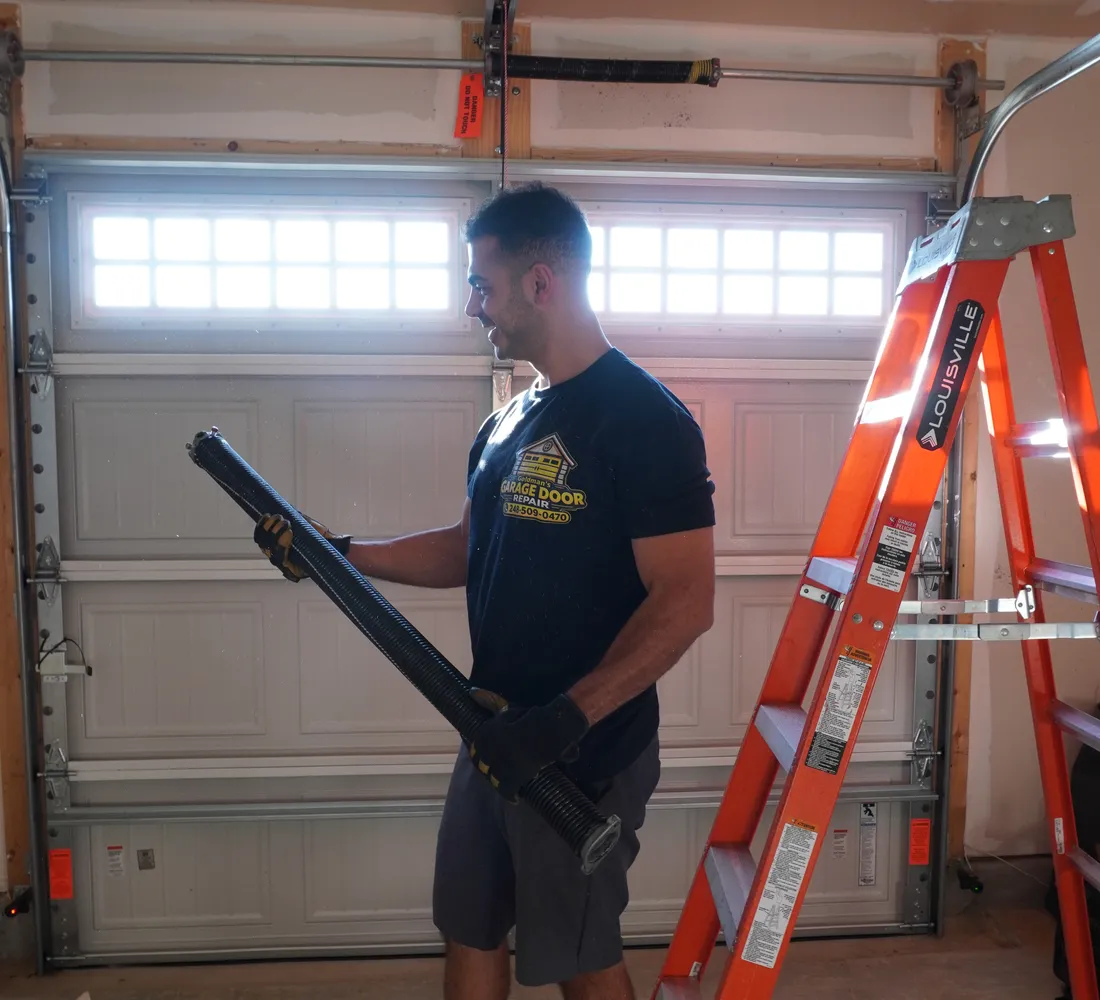 Goldman’s technician with a new garage door spring, serving Livonia, MI