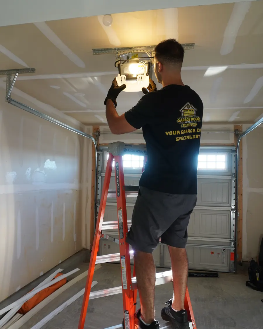 Goldman’s technician installing a garage door opener