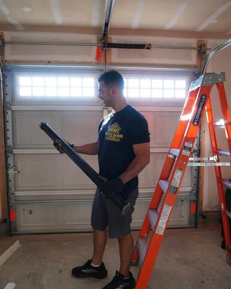 Goldman’s technician with a new torsion spring