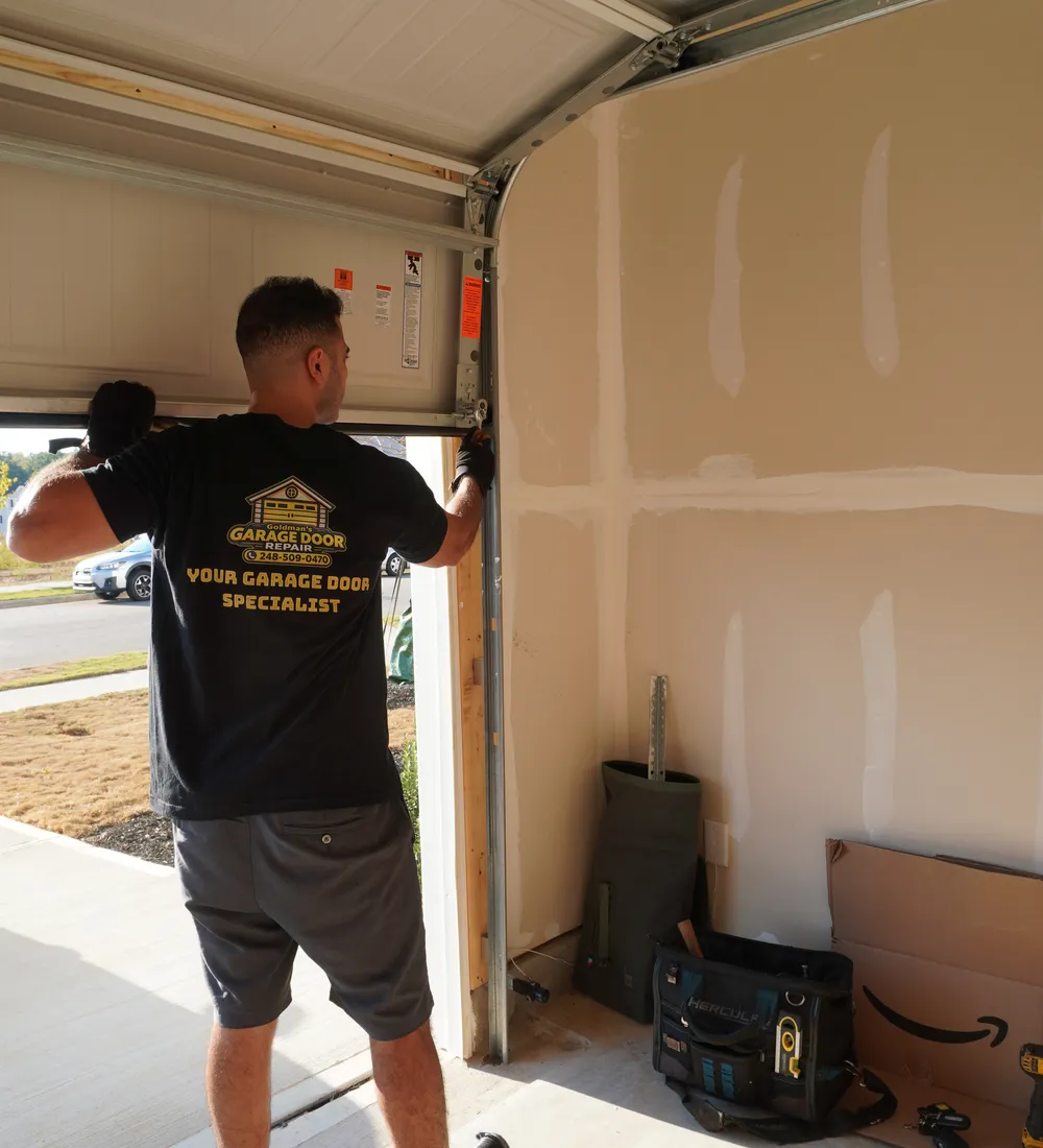 Goldman’s technician repairing a garage door near Livonia, MI